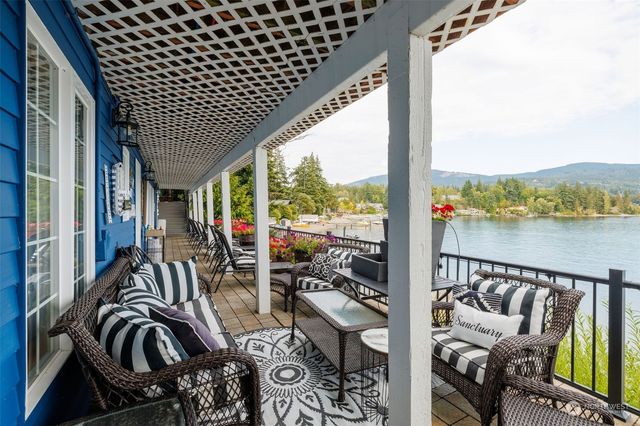 a view of a balcony dining table and chairs