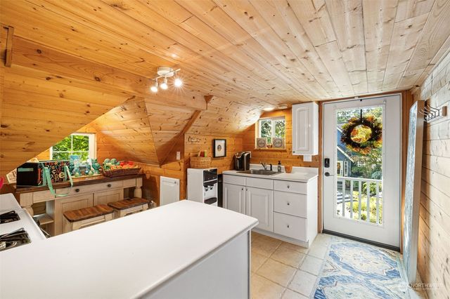 a bathroom with a sink mirror and toilet