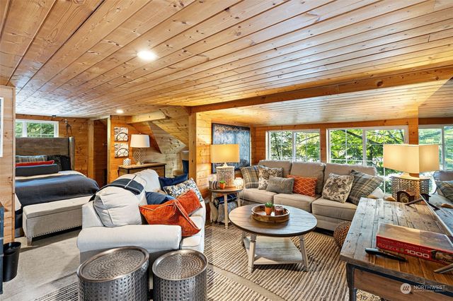 a living room with furniture and a table