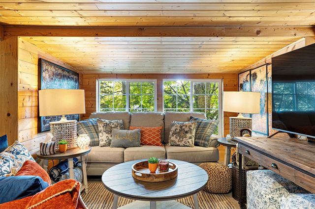 a bedroom with furniture and a fireplace