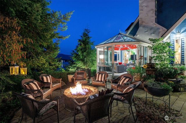 a view of a patio with table and chairs potted plants with wooden floor and floor