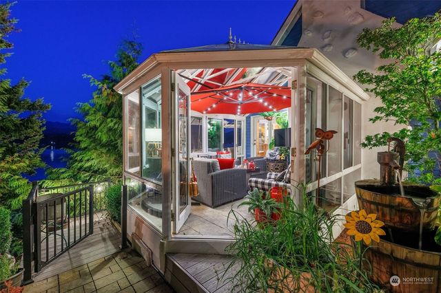 a view of an chairs and table in the patio