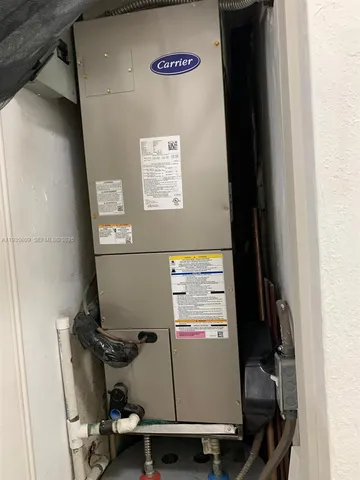 a room with water heater and car