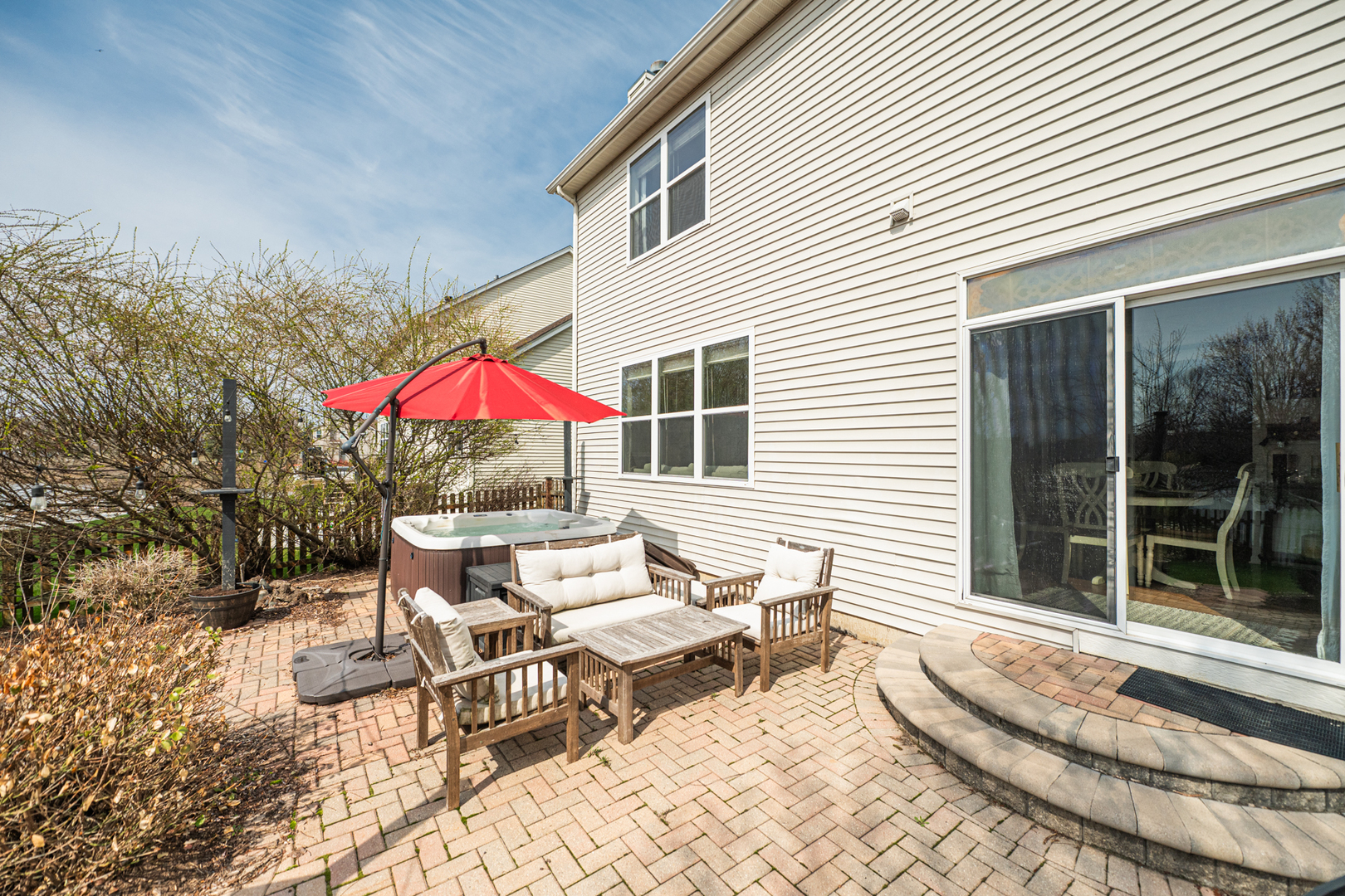 2440 Trailside Lane Wauconda, IL 60084 - Photo 57 of 64 a patio with a table and chairs and potted plants