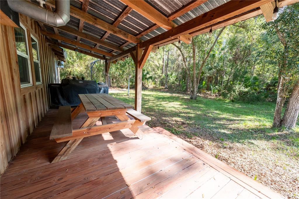 6550 Southwest 100 Court Cedar Key, FL 32625 - Photo 12 of 41 a view of swimming pool with a patio