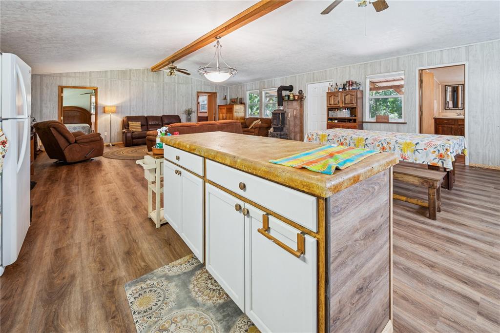 6550 Southwest 100 Court Cedar Key, FL 32625 - Photo 21 of 41 a living room with furniture and a wooden floor