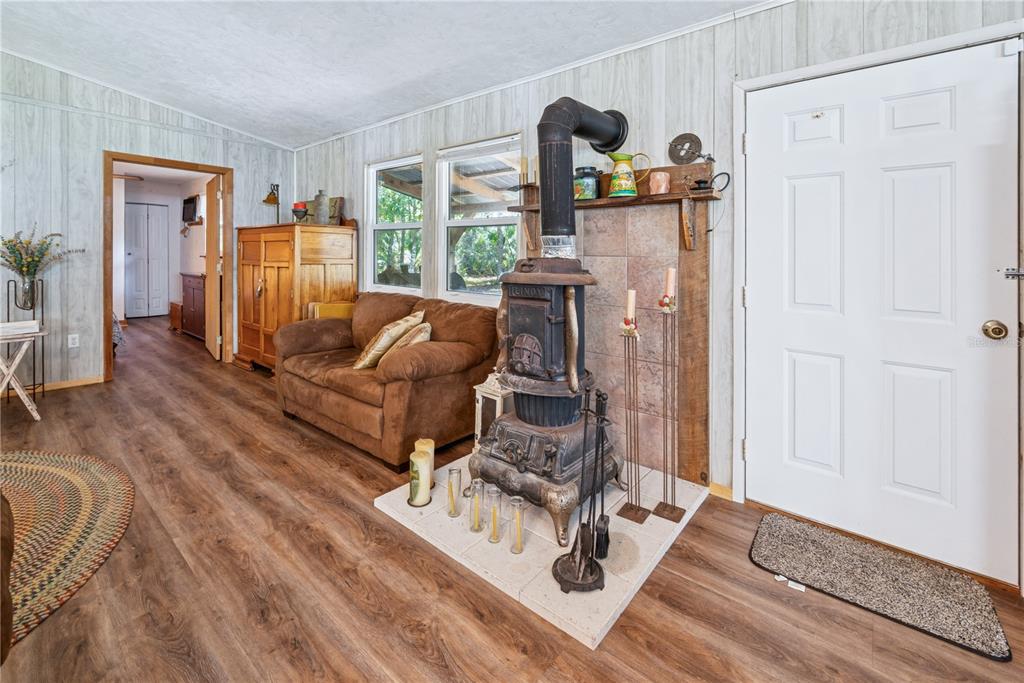 6550 Southwest 100 Court Cedar Key, FL 32625 - Photo 24 of 41 a living room with furniture and a wooden floor