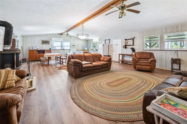 a bedroom with furniture and wooden floor