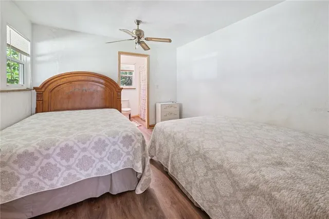 a bathroom with a toilet and a shower curtain