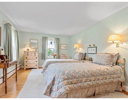 47 Kenilworth Road Wellesley, MA 02482 - Photo 13 of 25 a bedroom with a large bed and wooden floor