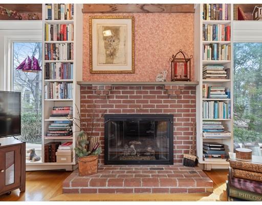 47 Kenilworth Road Wellesley, MA 02482 - Photo 8 of 25 a living room with furniture a flat screen tv and a fireplace