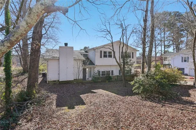 a view of a front door of a house with a yard