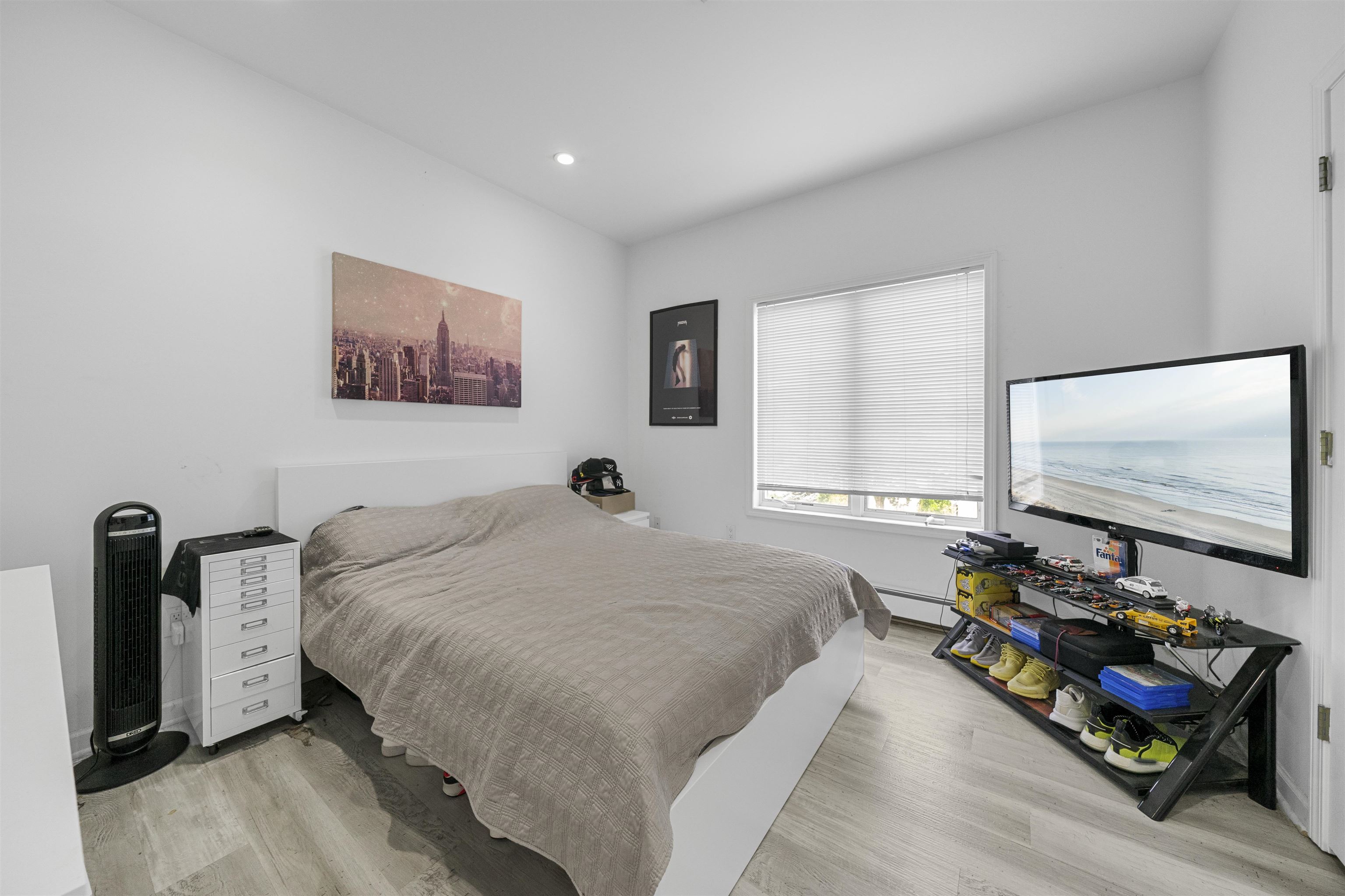 3911 Bayshore Road North Cape May, NJ 08204 - Photo 23 of 44 a bedroom with a bed and a flat screen tv