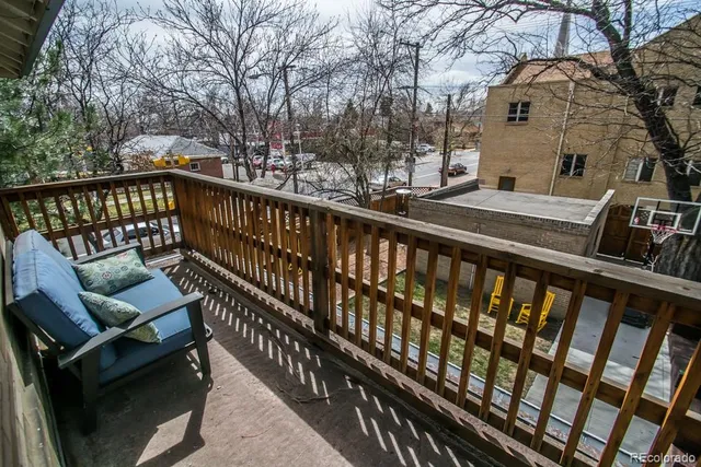 a view of a balcony with wooden floor