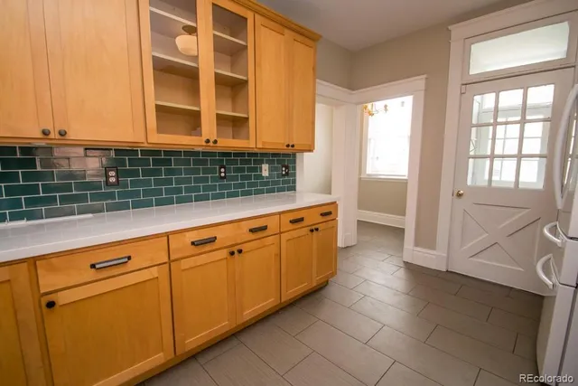 a kitchen with stainless steel appliances granite countertop a sink and cabinets
