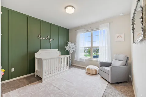 a view of a livingroom with furniture and a ceiling fan