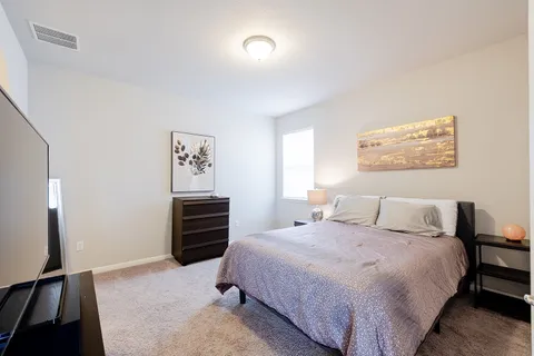 a spacious bathroom with a sink and a mirror