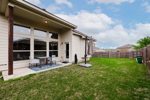 a view of kitchen with granite countertop cabinets and wooden floor