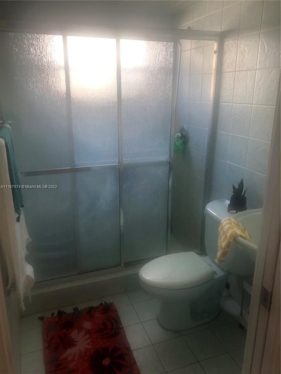 172 West 17th Street Hialeah, FL 33010 - Photo 17 of 27 a bathroom with a toilet and a shower