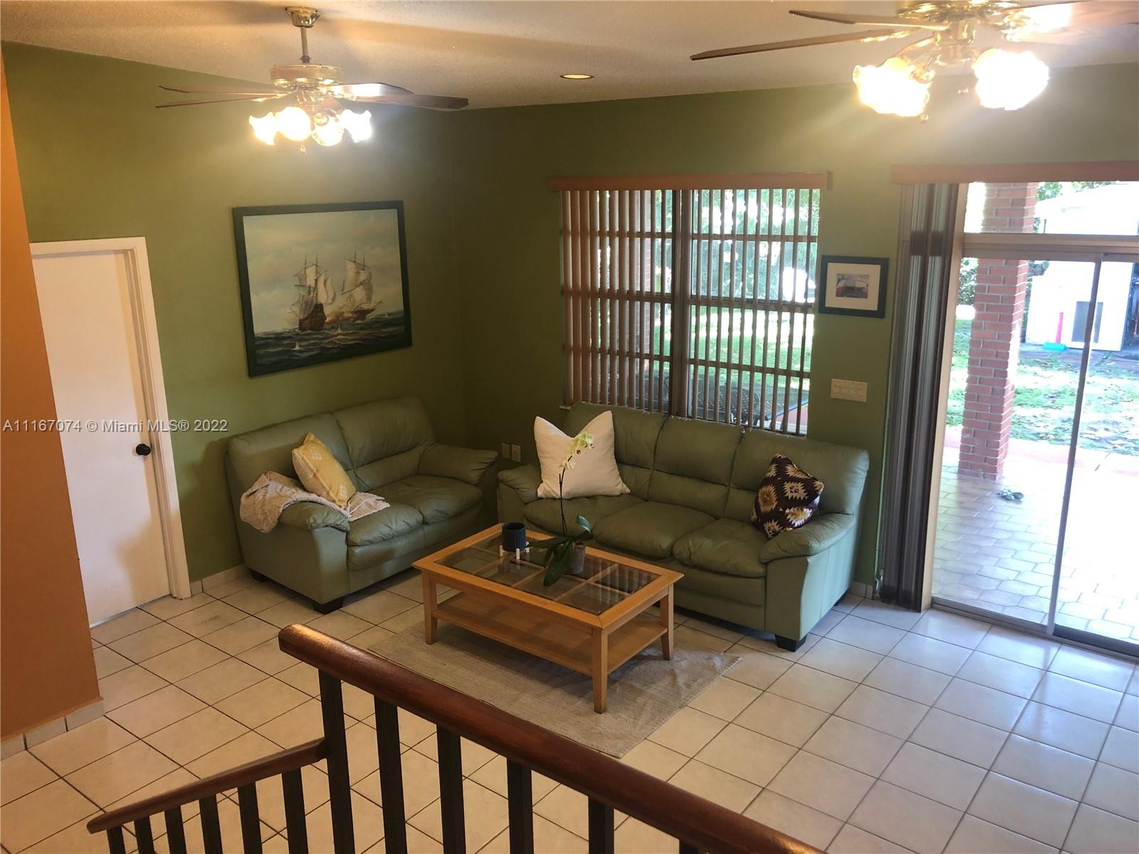 172 West 17th Street Hialeah, FL 33010 - Photo 19 of 27 a living room with furniture and a window