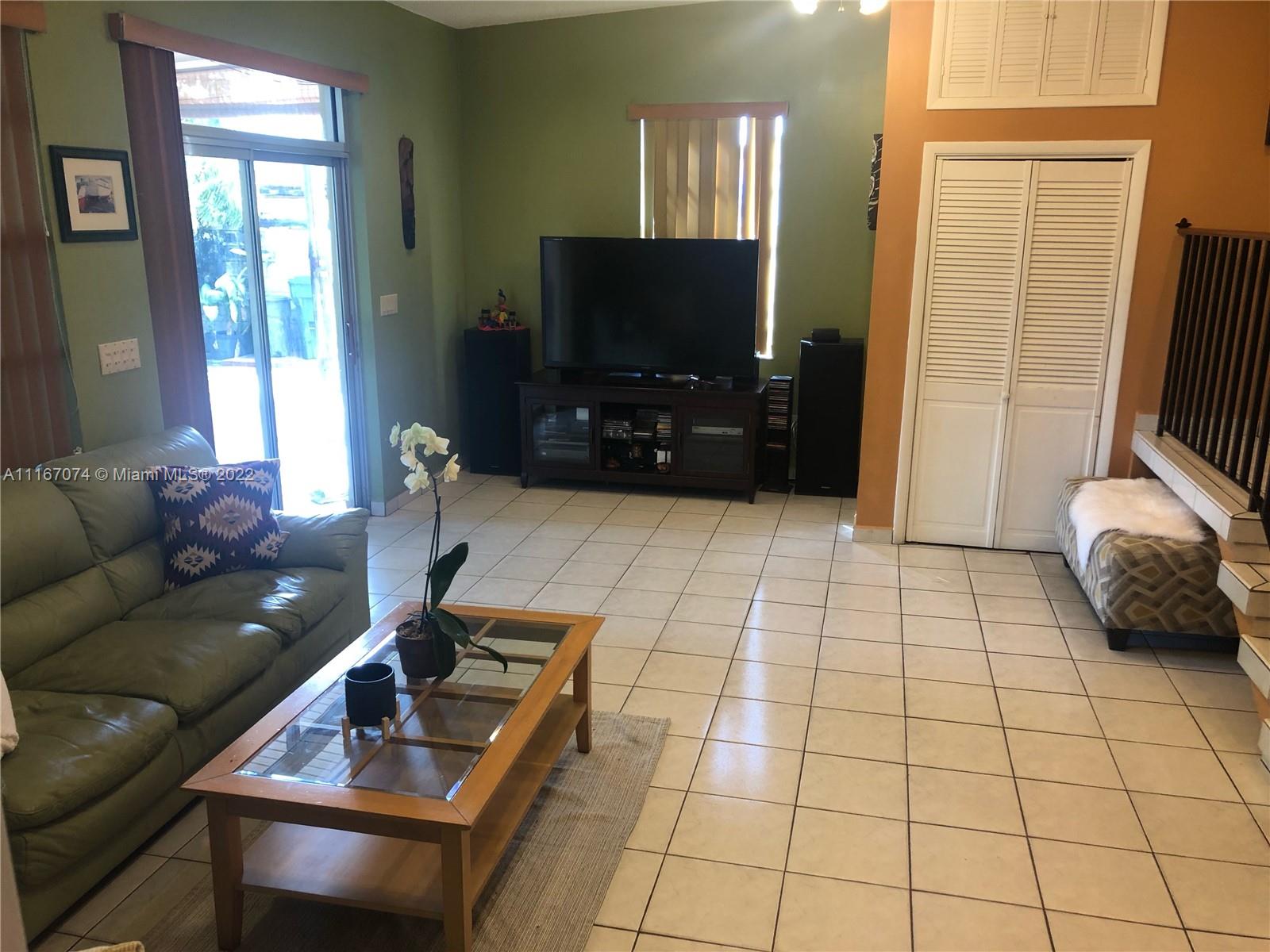 172 West 17th Street Hialeah, FL 33010 - Photo 20 of 27 a living room with furniture and a flat screen tv