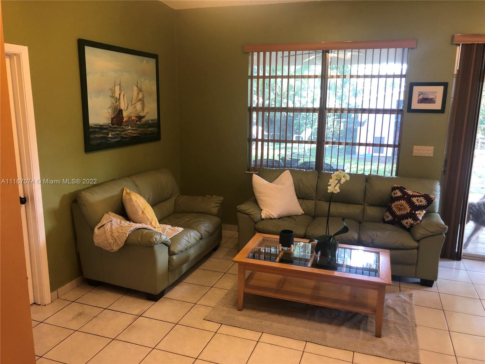 172 West 17th Street Hialeah, FL 33010 - Photo 21 of 27 a living room with furniture and a large window