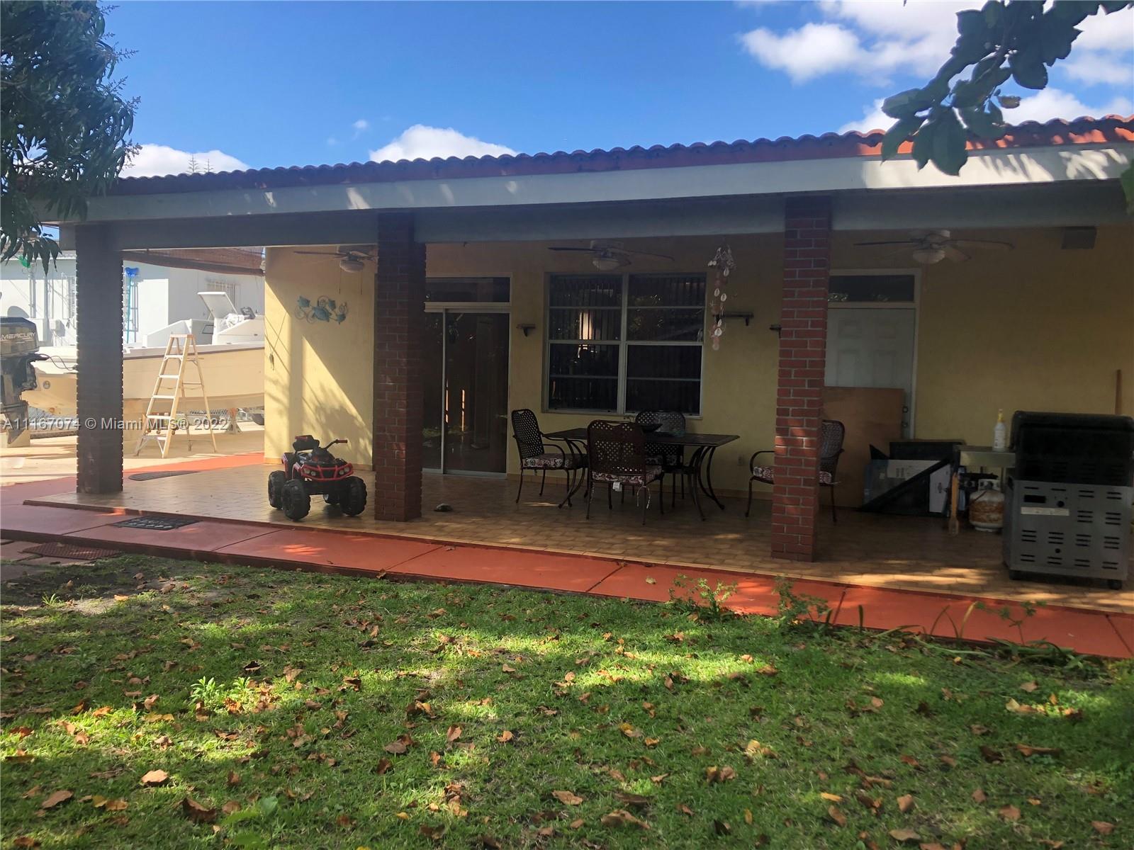 172 West 17th Street Hialeah, FL 33010 - Photo 22 of 27 a view of a house with backyard porch and sitting area