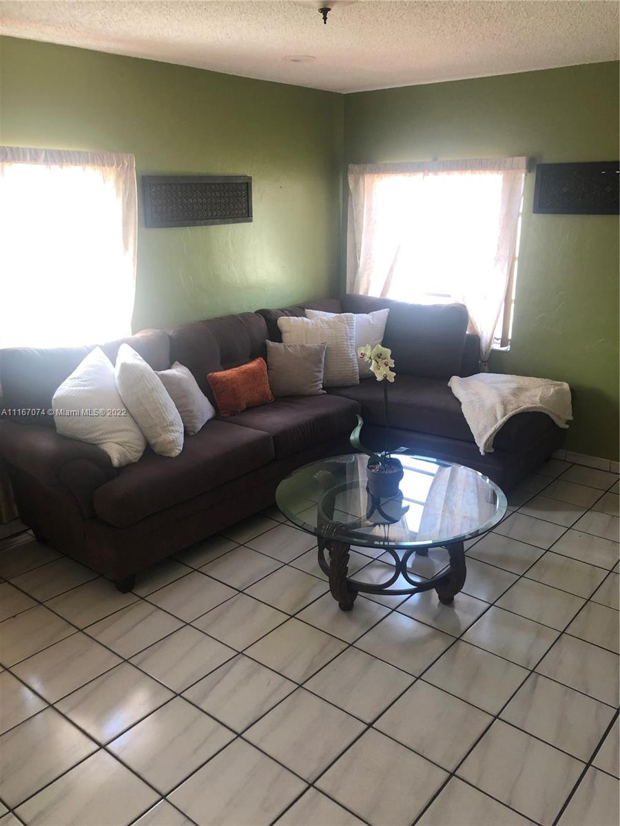 172 West 17th Street Hialeah, FL 33010 - Photo 7 of 27 a living room with furniture and a lamp