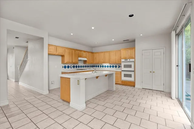 a view of a kitchen with electric appliances