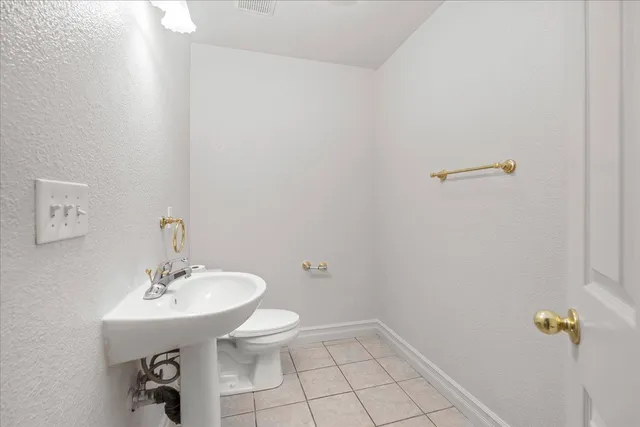 a bathroom with a sink a toilet