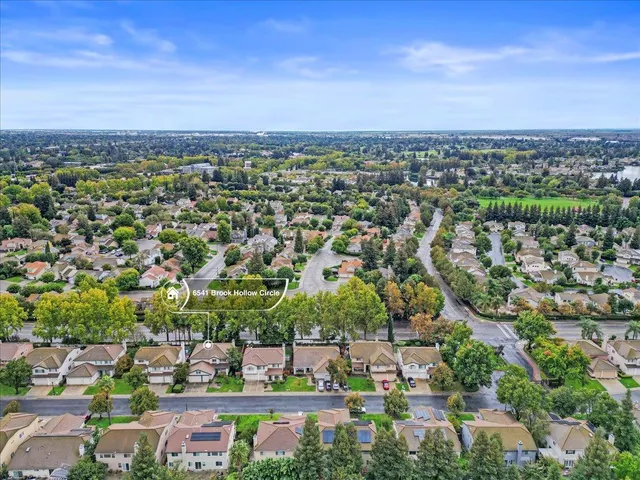 a view of a garden with an outdoor seating