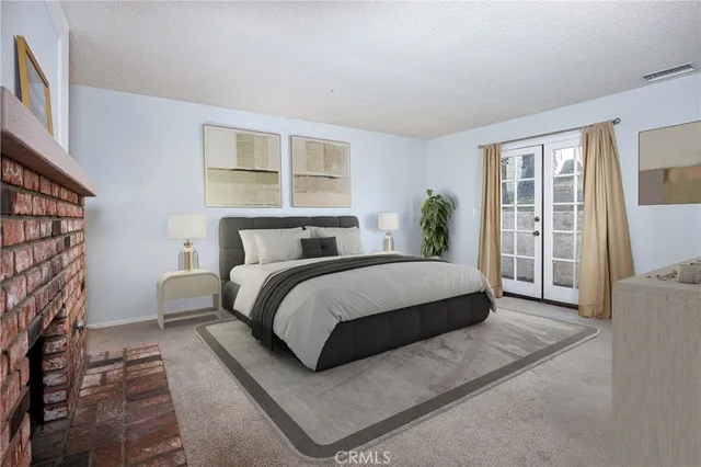 a bedroom with a bed and a couch