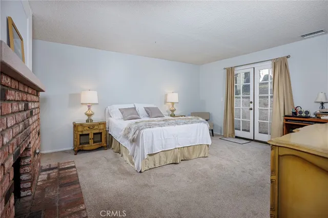 a bathroom with a double vanity sink toilet and a mirror