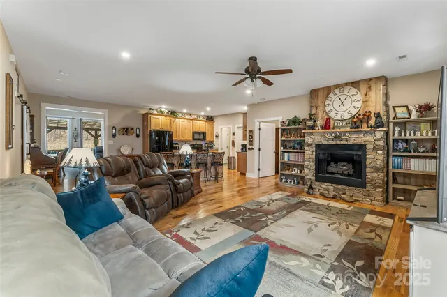 a living room with furniture and view of kitchen