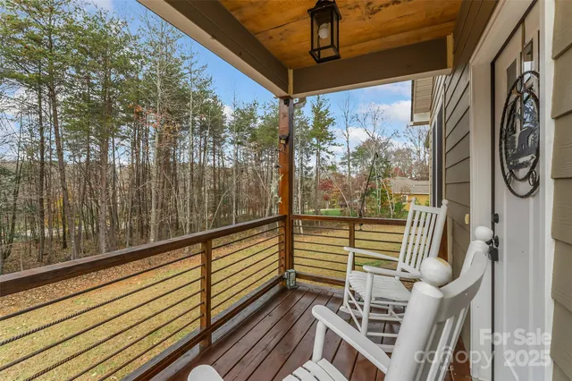 a view of a balcony with furniture