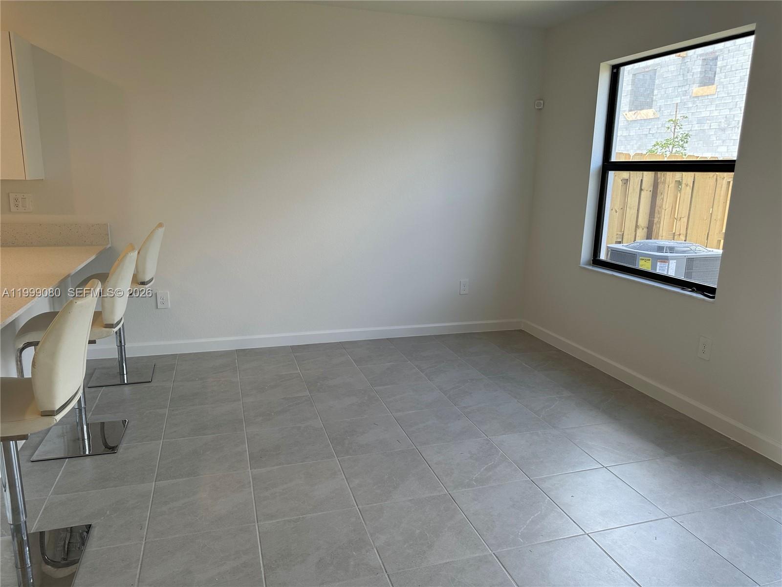 11767 Southwest 246th Terrace Homestead, FL 33032 - Photo 13 of 29 a view of an empty room with a window