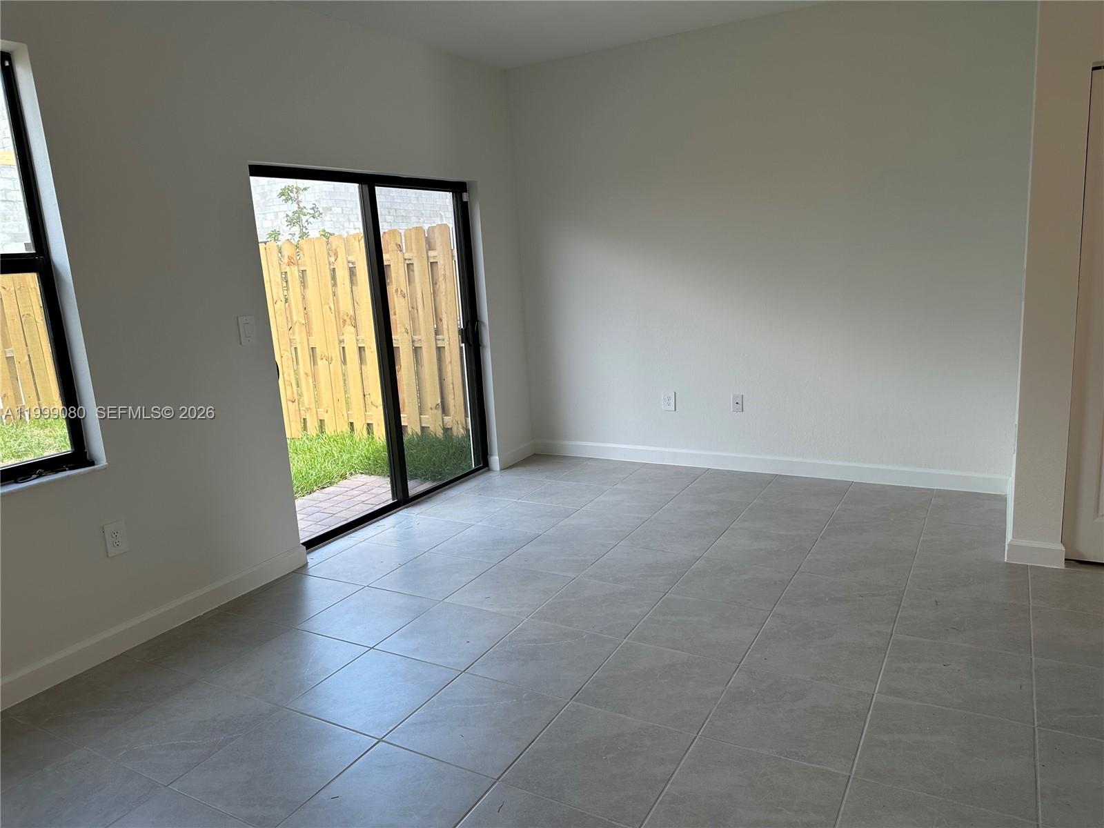 11767 Southwest 246th Terrace Homestead, FL 33032 - Photo 15 of 29 an empty room with windows