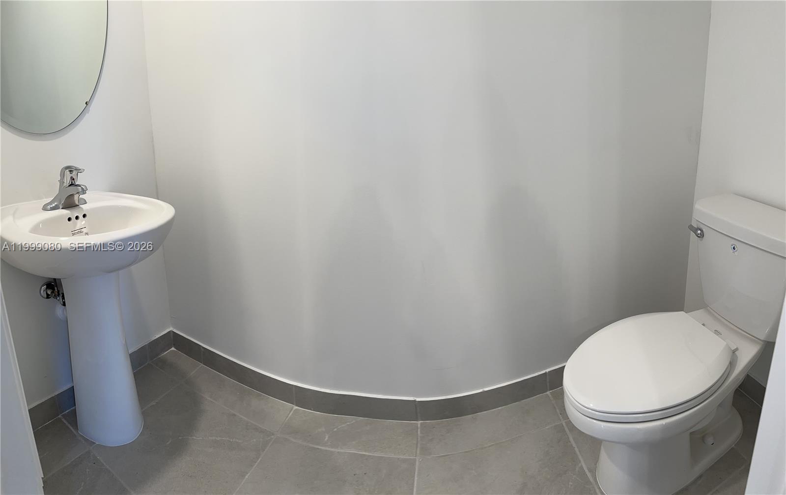 11767 Southwest 246th Terrace Homestead, FL 33032 - Photo 16 of 29 a bathroom with a sink and a mirror