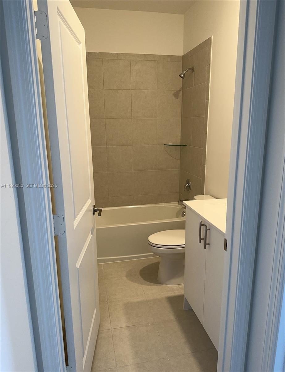 11767 Southwest 246th Terrace Homestead, FL 33032 - Photo 18 of 29 a bathroom with a toilet and shower