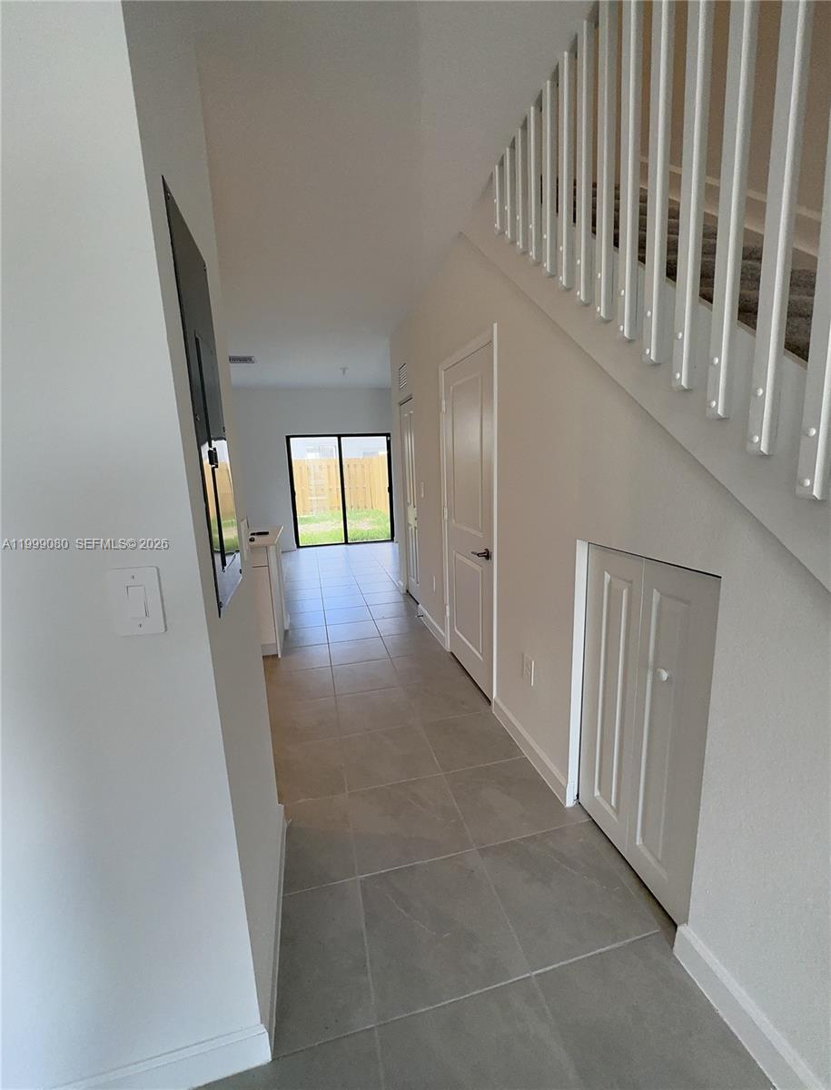 11767 Southwest 246th Terrace Homestead, FL 33032 - Photo 4 of 29 a view of an entryway with staircase