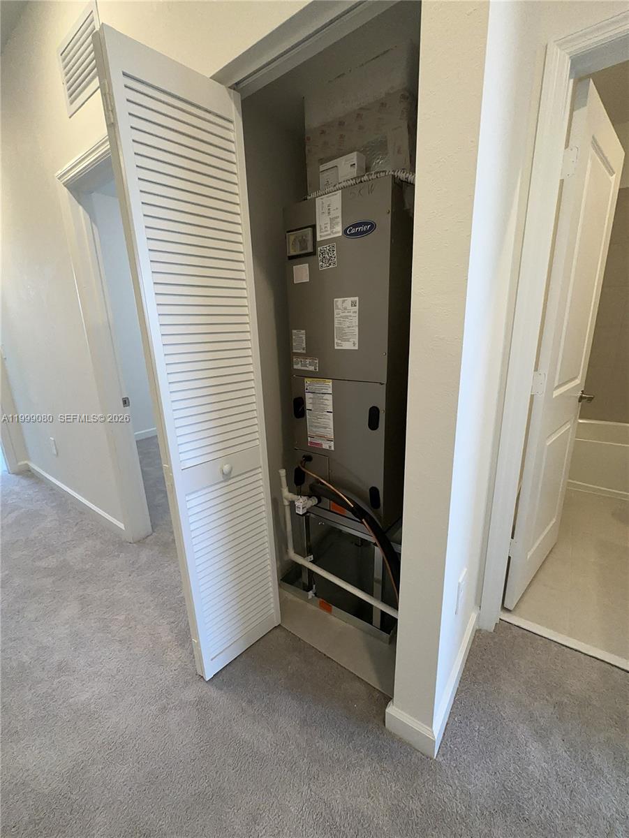 11767 Southwest 246th Terrace Homestead, FL 33032 - Photo 6 of 29 hallway with wooden floor and stairs