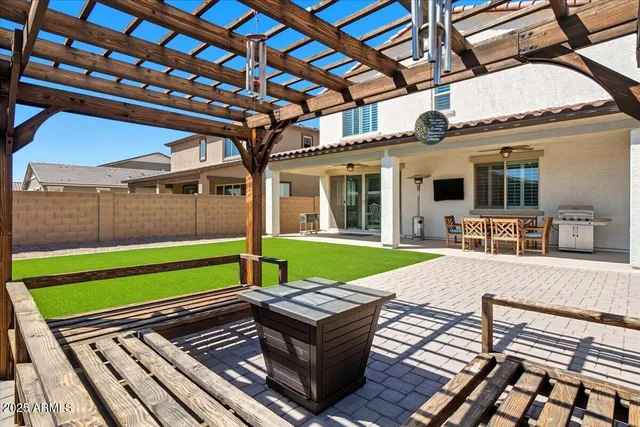 a view of a backyard with sitting area