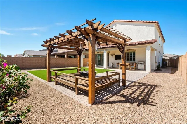 a view of a park with iron fence