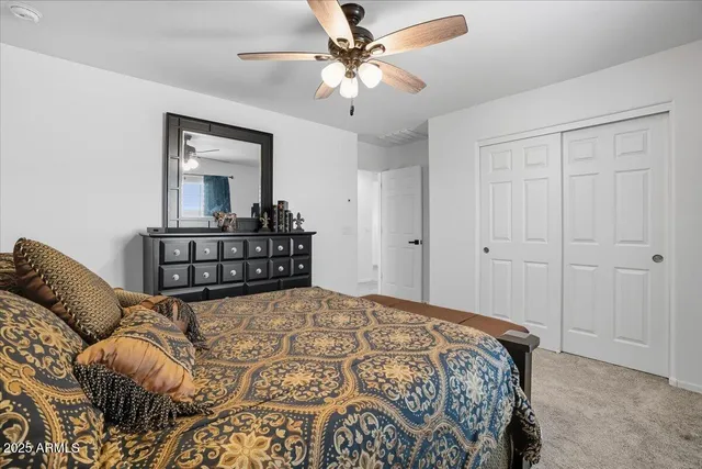 a bedroom with a bed and dresser