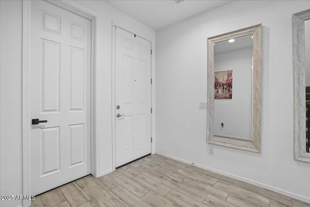 an empty room with closet area