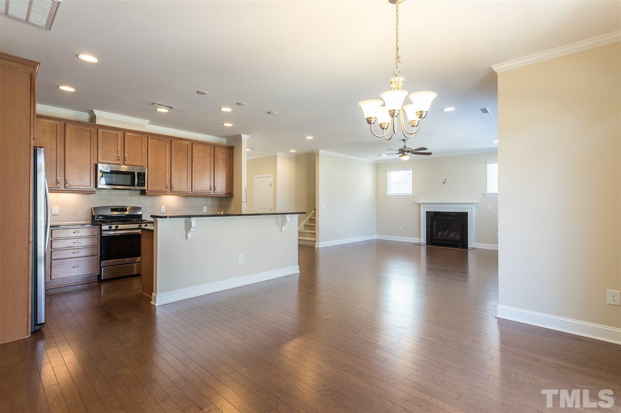 4244 Rockdell Hall Street Raleigh, NC 27616 - Photo 11 of 29 a view of a kitchen with stove and wooden floor