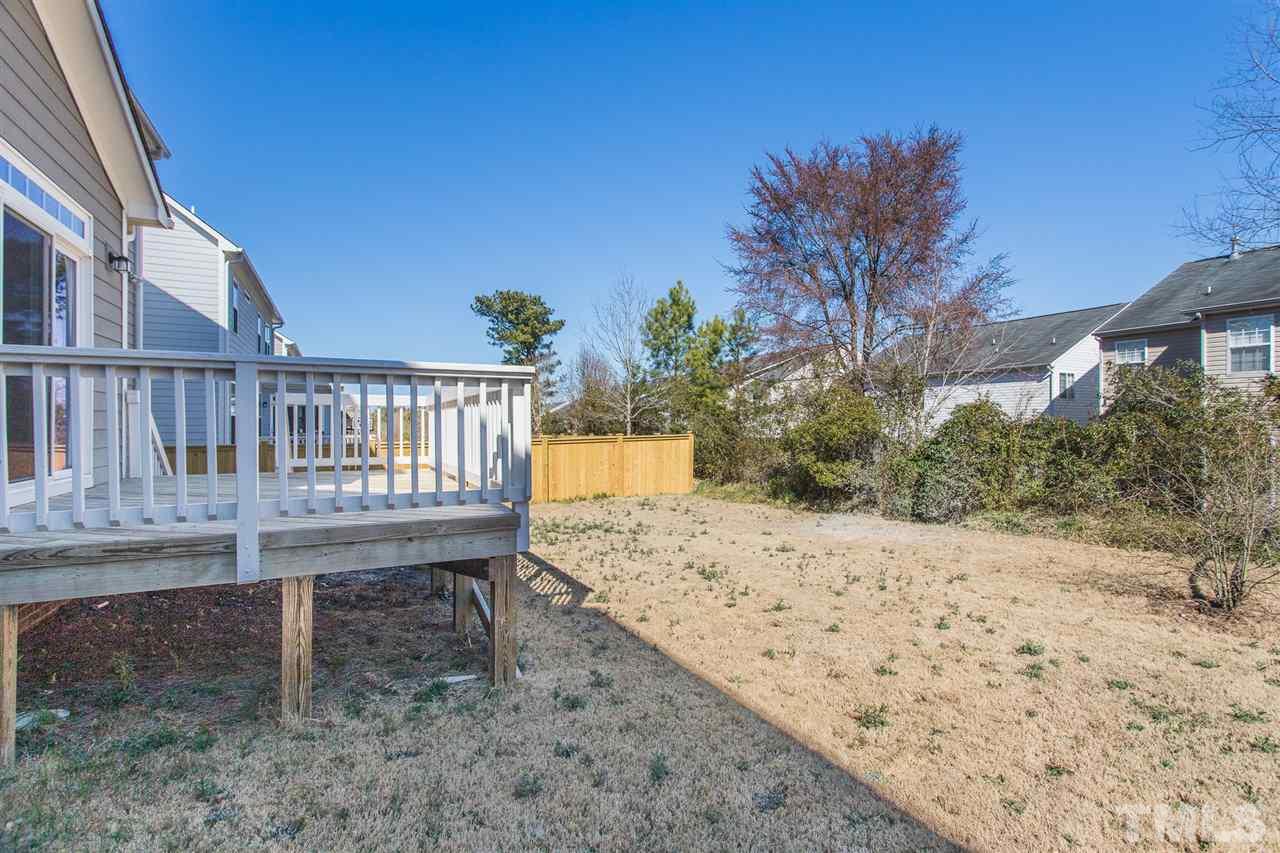 4244 Rockdell Hall Street Raleigh, NC 27616 - Photo 29 of 29 a view of a backyard with a wooden fence