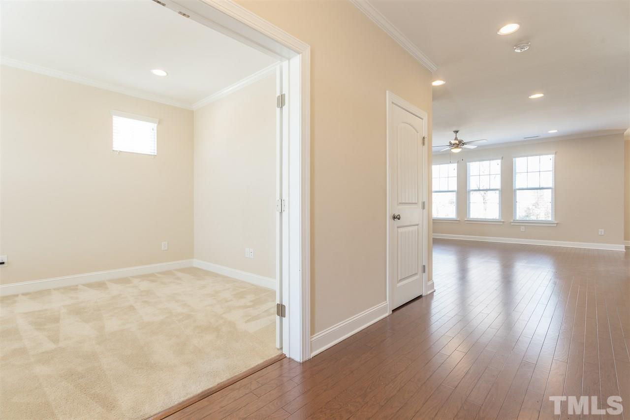 4244 Rockdell Hall Street Raleigh, NC 27616 - Photo 4 of 29 wooden floor in an empty room with a window