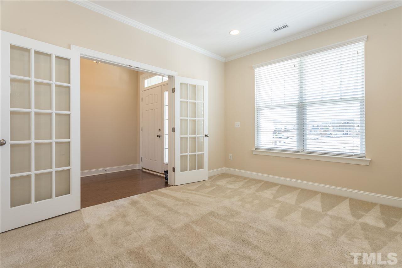 4244 Rockdell Hall Street Raleigh, NC 27616 - Photo 5 of 29 an empty room with windows and closet