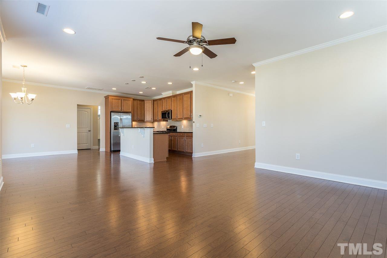 4244 Rockdell Hall Street Raleigh, NC 27616 - Photo 8 of 29 wooden floor in an empty room with a window